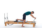 <p><strong>Setup</strong></p><ul><li><p>Standing, one foot on floor, leg bent, other foot against shoulder rest, leg bent, heel of foot on floor lined up with other foot, arms straight, hands place on footbar, inside hand in line with shoulder, trunk in C curve position</p></li><li><p>Resistance: light to medium | <strong>Springs:&nbsp; 1R (or 1R+1B)</strong></p></li></ul><p><strong>Movement</strong></p><ul><li><p>Inhale: Straighten leg against shoulder rest (not completely)</p></li><li><p>Exhale: Bend leg, return to start position</p></li><li><p>Change sides after 10 repetitions</p></li></ul><p><strong>Muscle Focus</strong></p><ul><li><p>Spinal flexors</p></li><li><p>Spinal extensors</p></li></ul><p><strong>Objectives</strong></p><ul><li><p>Pelvic lumbar stabilization</p></li><li><p>Scapular stabilization</p></li><li><p>Knee extensor control</p></li><li><p>Hip extensor control</p></li></ul><p><strong>Cues</strong></p><ul><li><p>Maintain C curve position</p></li><li><p>Focus on hip disassociation</p></li><li><p>Keep standing leg bent and stable</p></li><li><p>Keep pelvis at consistent height</p></li></ul><p></p>