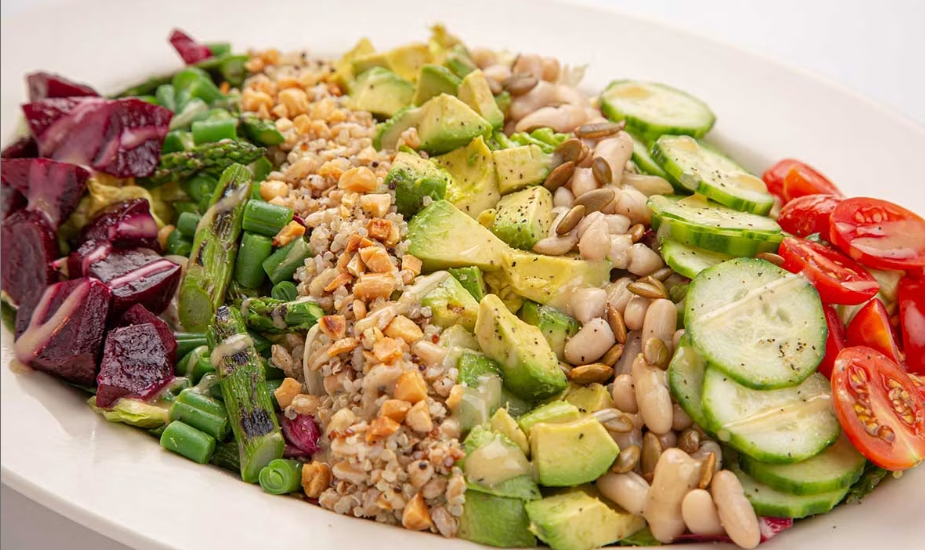 <p>Crisp Lettuce, Grilled Asparagus, Avocado, Roasted Beets, Green Beans and Tomato, Cucumber, Carrot, White Beans, Quinoa, Farro, Almonds and Toasted Pepitas with House Vinaigrette</p>