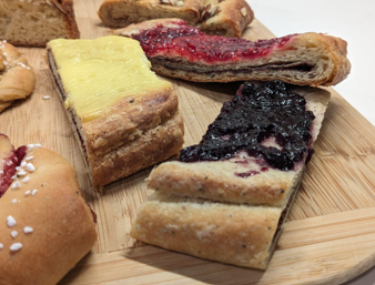 <p>Flaky, buttery pastry with almond filling and topped with either pastry cream or jam</p>
