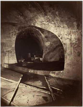 <p><span style="background-color: transparent;">Félix Nadar photographed the underground infrastructure of Paris during the modernization of the city. The photograph documents sewer tunnels built during the massive urban renovations under Georges‑Eugène Haussmann. From an urban studies perspective, it highlights the importance of invisible infrastructure—sanitation, drainage, and engineering—in creating a modern, healthy city. The image reflects how nineteenth-century urban planning increasingly focused on public health and technological control of the urban environment.</span></p>
