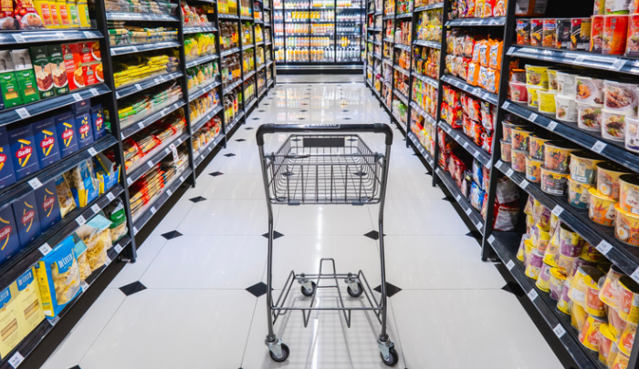 <p>Is a large, self-service grocery store owned by a single company. Instead of buying from individual vendors, you walk through aisles with a shopping cart, pick packaged foods or household items yourself, and pay at a central register.</p>