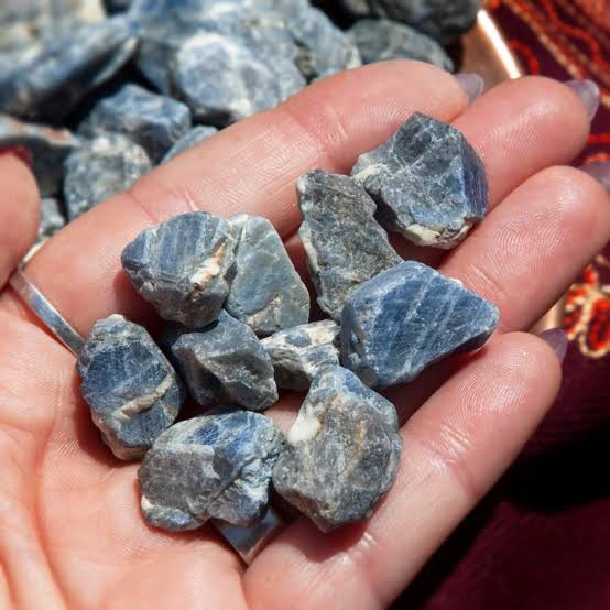 <p><span>The <strong>blue color of sapphire </strong>is primarily due to which impurity ions substituting for aluminum in corundum?</span></p>