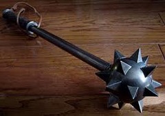 <p>a short, heavy thick club</p><p>The police arrested the lumberjack on suspicion of ___________ a co-worker with an axe handle.</p>
