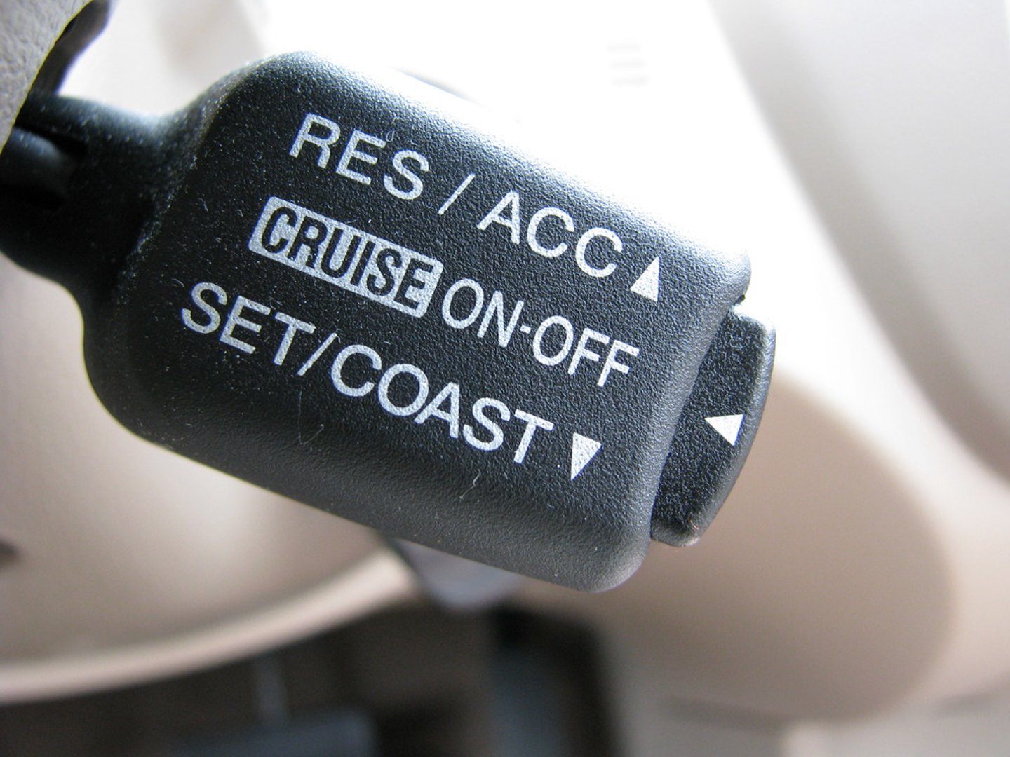 <p>(Sometimes known as speed control or auto cruise, or tempomat in some countries) is a system that automatically controls the speed of a motor vehicle. The system is a servomechanism that takes over the throttle of the car to maintain a steady speed as set by the driver.</p>