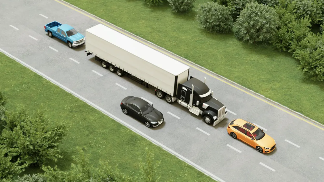 <p>Which car is likely in the truck driver's blind spot?</p>