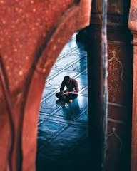 <p>A student photographs a person through a doorway so the doorway surrounds the subject visually. Which compositional strategy is being used?</p>