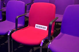 <p>Here you are / take a seat</p>