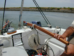 <p>The lever arm attached to the rudder that allows you to steer the boat</p>