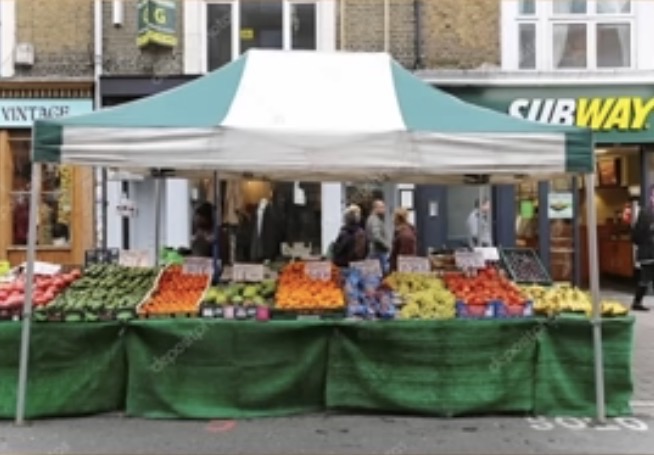 <p>The vendor sells fresh strawberries at his market stall."</p>