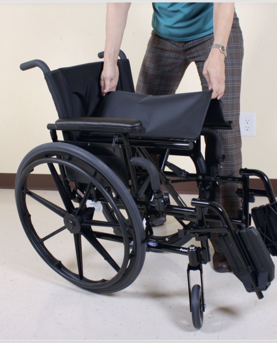 <p>Pulling up on the center of the seat cushion</p>