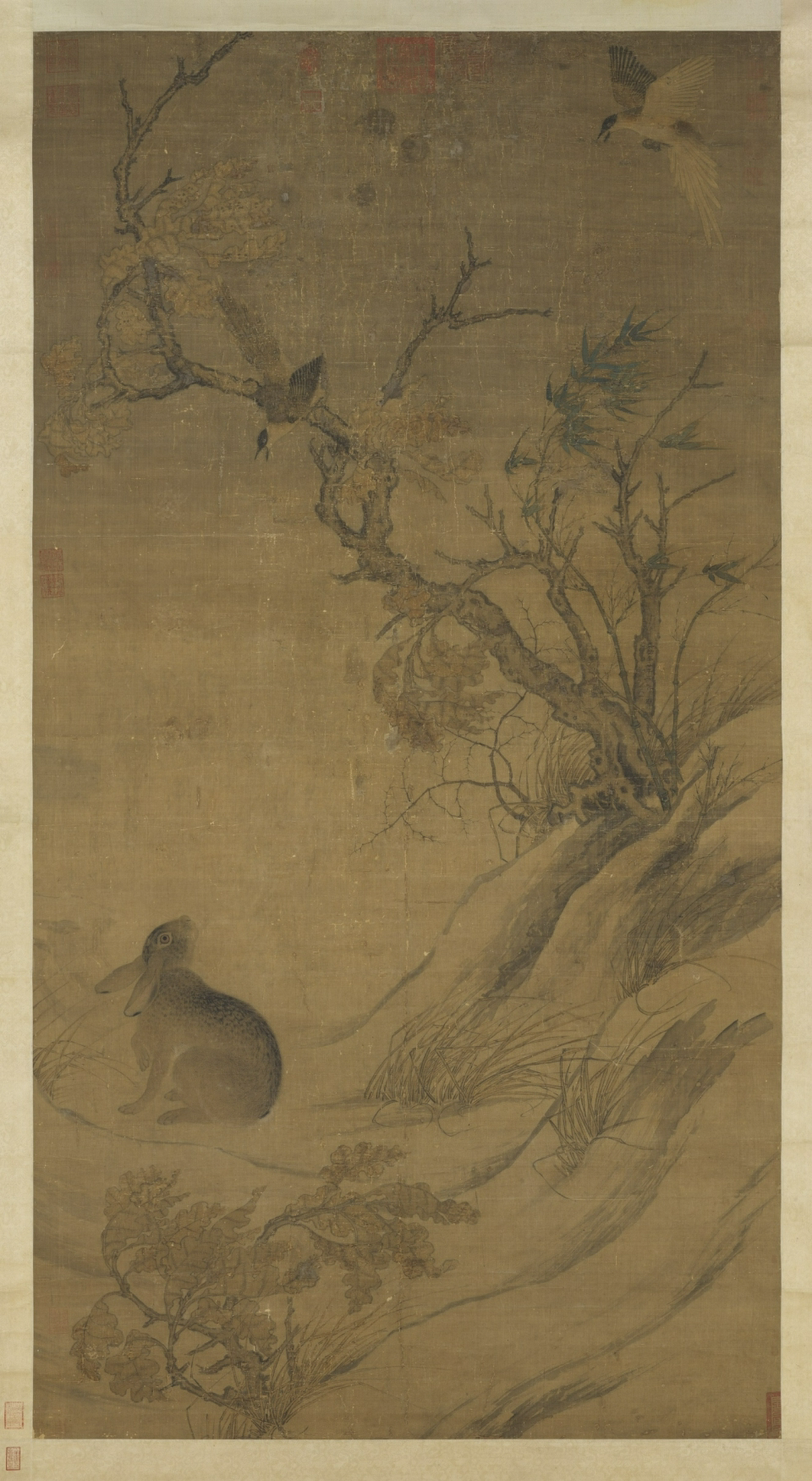<p>“double happiness,” a painting to be given to a happy occasion, such as a wedding. Alfreda Murk’s political interpretation: mood is desolate, in stormy setting with winds blowing on bare trees and bamboos. Two magpies, the lighter one in flight representing</p><p>Princess Yuan Guo (1038–1070), who is fond of her eunuch (represented by the crafty hare); and the darker one screeching at the hare, representing the husband of Yuan Guo princess, Li Wei, who is weary of her eunuch encroaching onto their marriage. The painting is, according to Murk, a critique of Emperor Renzhong who was unable to keep his daughter from excessively relying on the eunuch's influences.</p><p>Another political interpretation of the painting has the magpies represent the literati (the prime minister Sima Guang’s conservative faction), who are situated near the bamboos that represent moral upright. They are screeching at the crafty hare, near the thorny weeds, representing the reformist Wang Anshi’s faction, who are about to encroach onto their territories with his New Policies (that emphasize strong state control).</p>