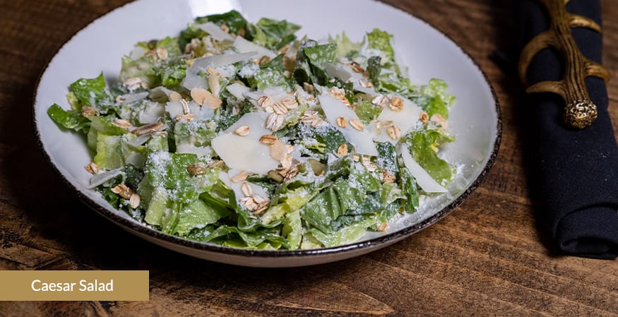 <p>Romaine, Pumpkin Seeds, Rolled Oats, Toasted Almonds, Parmesan Cheese, Caesar Dressing</p>