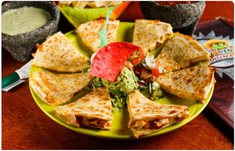 <p>Chicken Fajita (12.29) / Beef Fajita / Combo (12.89) Your choice of protein with American and Monterey Jack cheese in between (2) flour tortillas. Served with sour cream, guacamole, and pico de gallo.</p>