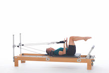 <p><strong>Setup</strong></p><ul><li><p>Starting in Extension Position (page 63), hands in straps, arms straight by sides of body, palms facing carriage</p></li><li><p>Resistance: light to medium | <strong>Springs: 1B or 1R</strong></p></li></ul><p><strong>Movement</strong></p><ul><li><p>Inhale: Bend arms</p></li><li><p>Exhale: Straighten arms, return to start position</p></li></ul><p><strong>Muscle Focus</strong></p><ul><li><p>Elbow extensors</p></li><li><p>Scapular stabilizers</p></li><li><p>Spinal flexors</p></li><li><p>Hip flexors</p></li></ul><p><strong>Objectives</strong></p><ul><li><p>Elbow extensor strength</p></li><li><p>Scapular stabilization</p></li><li><p>Trunk stabilization</p></li></ul><p><strong>Cues</strong></p><ul><li><p>Maintain scapular stabilization</p></li><li><p>Keep trunk and legs stable</p></li><li><p>Keep elbows pressing against sides of body</p></li><li><p>Keep wrists straight and stable</p></li><li><p>Keep upper arms parallel to floor and in line with shoulders</p></li></ul><p></p>