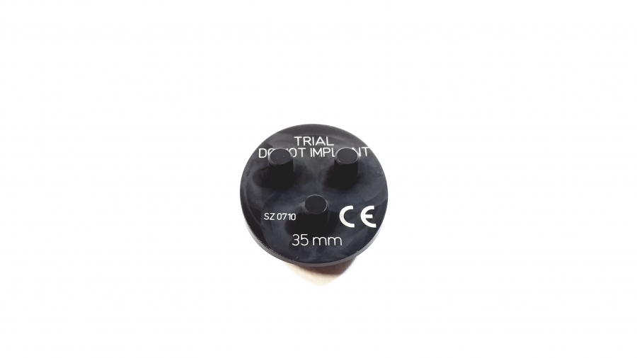 <p>Provisional patellar button to check thickness and tracking.</p>