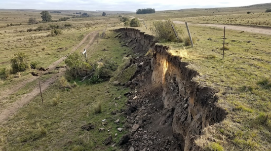 <p><span>A low cliff formed by the trace of a fault on Earth's surface after permanent land displacement.</span></p>