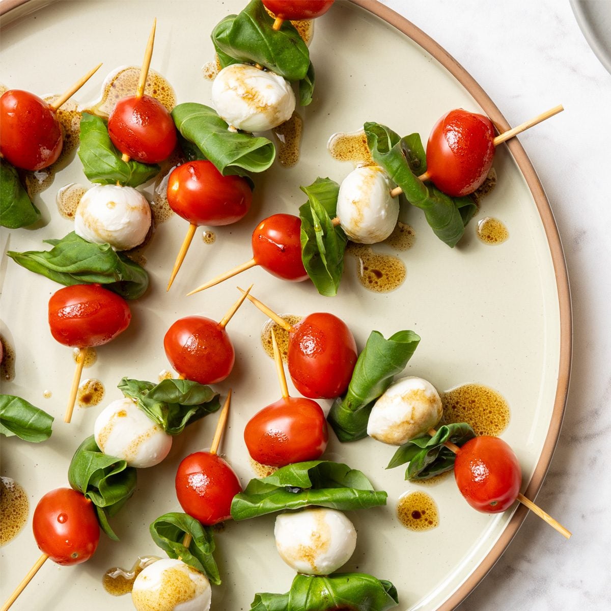<p>A small dish of food or a drink taken before a meal or the main course to stimulate one's appetite.</p>