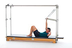 <p><strong>Setup</strong></p><ul><li><p>Start in Mini Roll-Up position (page 96), one hand holding PTBar, palm facing up aligned with shoulder, other hand behind head, lift to Chest Lift position, rotate trunk to Chest Lift with Rotation position (Mat page 18)</p></li><li><p>Resistance: light to medium <strong>[Top loaded] 2 springs</strong></p></li></ul><p><strong>Movement</strong></p><ul><li><p>Exhale: Lift trunk</p></li><li><p>Inhale: Lower trunk, return to start position</p></li><li><p>Final Inhale: Return to center, lower trunk to supine position</p></li><li><p>Change sides after 5 repetitions</p></li></ul><p><strong>Muscle Focus</strong></p><ul><li><p>Spinal rotators</p></li><li><p>Spinal flexors</p></li><li><p>Shoulder flexors</p></li></ul><p><strong>Objectives</strong></p><ul><li><p>Spinal rotator strength</p></li><li><p>Spinal flexor strength</p></li><li><p>Pelvic lumbar stabilization</p></li></ul><p><strong>Cues</strong></p><ul><li><p>Maintain pelvic lumbar stabilization</p></li><li><p>Maximize rotation while avoiding lateral flexion</p></li><li><p>Maintain engagement of abdominal obliques</p></li><li><p>Keep nose aligned over sternum</p></li></ul><p></p>