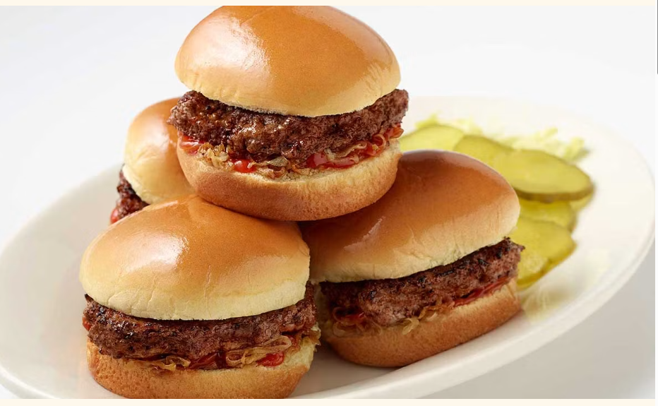 <p>Bite-Sized Burgers on Mini-Buns Served with Grilled Onions, Pickles and Ketchup</p>