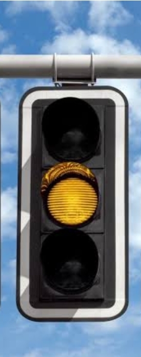 <p><em>Stop </em>if it is <strong>safe</strong>. Go only if <u>stopping</u> is <strong>dangerous</strong>.</p>
