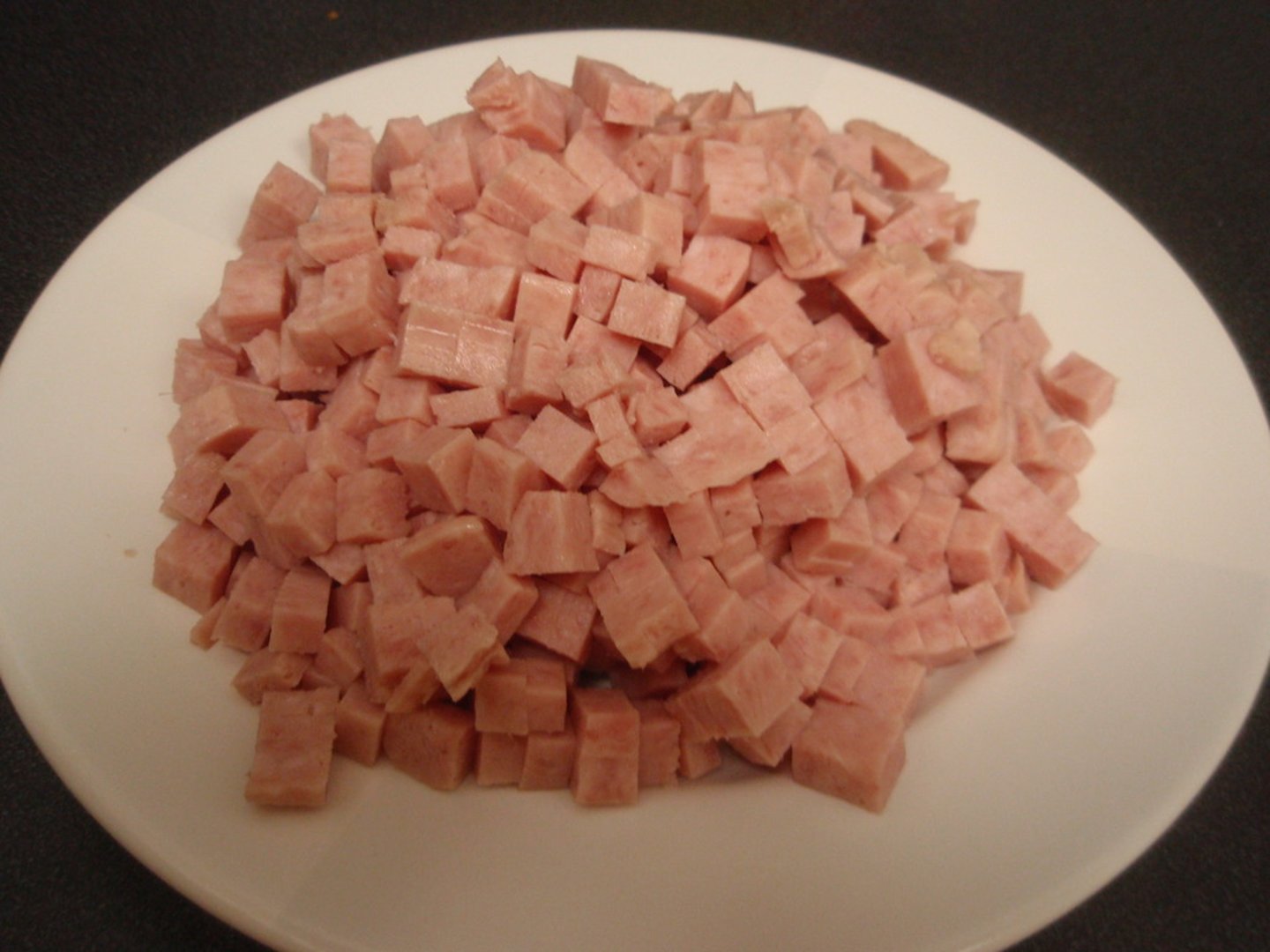<p>to cut food into very small cubes usually <1 inch</p>