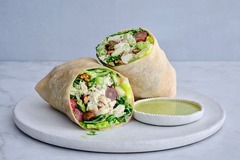 <p>Our riff on the traditional Waldorf salad includes roasted chicken, apples, dates, grapes, crunchy nuts, kale slaw, and gem lettuce in a cassava flour wrap.</p><p>Sauce options: Lemon pesto Vinaigrette (rec) Non-Dairy ranch dressing, apple cider Vinaigrette, no side sauce. </p><p>Extra sauce +$1.95</p><p>Modifications: none</p><p>Allergens: Tree nuts (pecans), soy, sesame (everything contains sesame)</p>