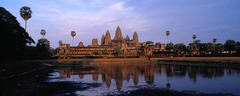 <p>A teacher displays an image of Angkor Wat and asks students why the complex was designed with towering structures, a surrounding moat, and highly ordered spatial organization. Which explanation BEST reflects the religious ideas embodied in the design?</p>
