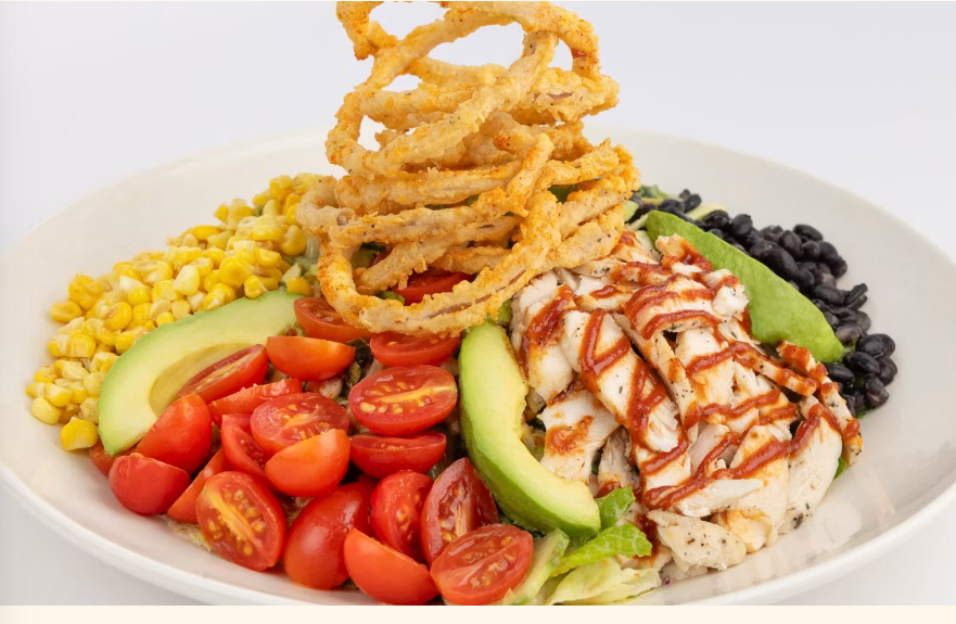 <p>Avocado, Tomato, Grilled Corn, Black Beans, Cucumber and Romaine All Tossed with Our Barbeque Ranch Dressing. Topped with Lots of Crispy Fried Onion Strings for Crunch</p>