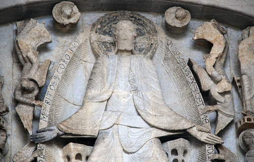 <p><span>a large Christ, the most important figure, was placed centrally with hierarchical emphasis. </span></p><p><span>-He's placed in a </span><em>mandorla,</em><span> an almond-shaped nimbus that's like a halo, signifying his divine status. A heavenly city is behind him.</span></p>