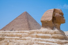 <p>The pyramids shown in this image were originally built primarily as:</p>