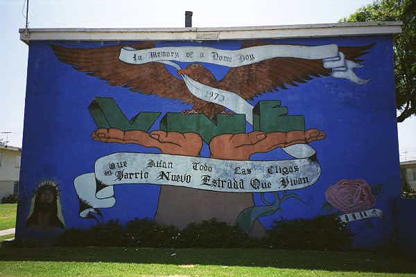 <p>It serves as a somber tribute to a victim of gang violence and remains one of the most culturally significant works within the historic Estrada Courts mural collection.</p>