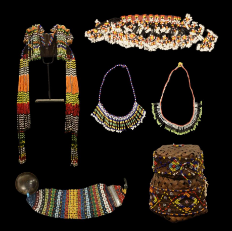 <p>Ornamental pieces worn on the body, crafted from metal, beads, shells, or other materials to signify status or beauty.</p>