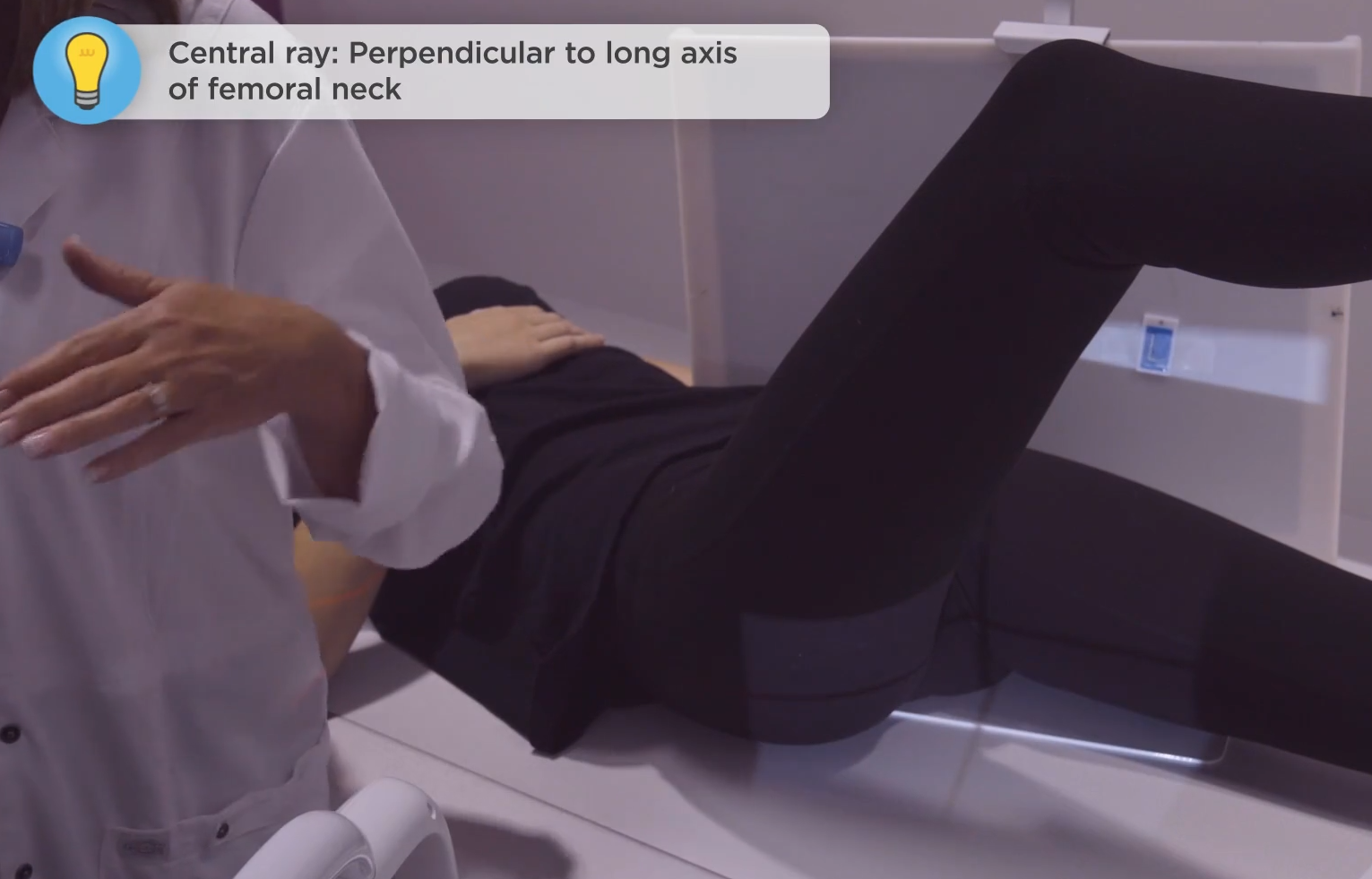 <p>Perpendicular to long-axis of femoral neck</p>