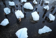 <p>The art in this photo is Ice Watch by Olafur Eliasson. It included massive blocks of glacial ice . Viewers were encouraged to touch the ice, hear the popping of ancient air bubbles, and watch the works melt to physically connect with the realities of climate change. This art is an example of</p>