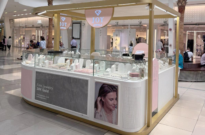 <p>A small permanent booth, often found in malls, airports, or train stations.</p>