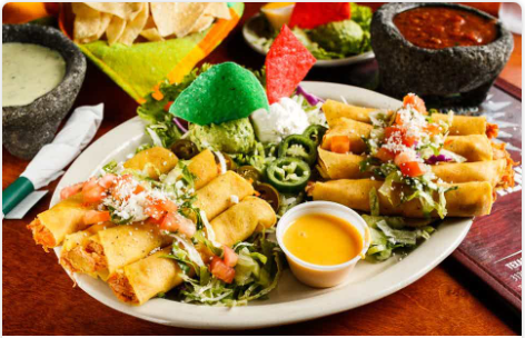 <p>(8) Corn tortillas rolled with shredded chicken. Served with guacamole, sour cream, jalapenos, and queso.</p>