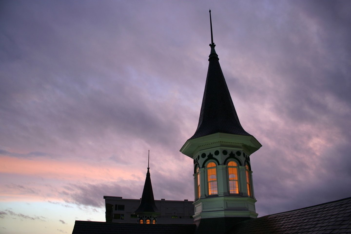 <p>a tapering conical or pyramidal structure on the top of a building, typically a church tower.</p>