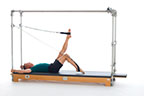 <p><strong>Setup</strong></p><ul><li><p>Starting in Walking position(page 102)</p></li><li><p>Resistance: light to medium</p></li></ul><p><strong>Movement</strong></p><ul><li><p>Exhale: Lower right leg toward mat, create L shape, bend right knee to 90 degrees and flex hip bringing leg toward chest, straighten leg to ceiling. Simultaneously lower left leg toward mat, create L shape, bend left knee to 90 degrees and flex hip bringing leg toward chest, straighten leg to ceiling.</p></li><li><p>Inhale: Simultaneously lower right leg toward mat, create L shape. Continue with this exact movement pattern of right and left leg while inhaling.</p></li><li><p>Repeat entire breath cycle (exhale and inhale) 3 times, reverse direction and again repeat entire breath cycle 3 times</p></li></ul><p><strong>Muscle Focus</strong></p><ul><li><p>Hip extensors</p></li><li><p>Knee extensors</p></li></ul><p><strong>Objectives</strong></p><ul><li><p>Pelvic lumbar stabilization</p></li><li><p>Hip disassociation</p></li><li><p>Hip extensor control</p></li></ul><p><strong>Cues</strong></p><ul><li><p>Maintain spring tension throughout</p></li><li><p>Establish L shape with legs in each cycle</p></li><li><p>Keep legs parallel avoiding hip external rotation</p></li></ul><p></p>