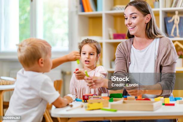 <p>engage</p><p>(She engaged the children in a game.)</p>