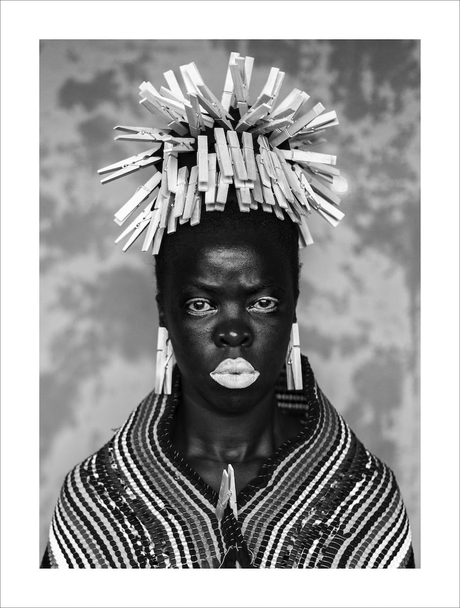 <p></p><p>Zanele Muholi’s work is identifiable through powerful black-and-white portrait photography centered on Black LGBTQIA+ lives in South Africa. Expect direct, frontal compositions, intense eye contact, and dignified staging. Their aesthetic is minimal but emotionally charged, often emphasizing identity, resistance, and visibility. Hair, lighting, and expression are highly intentional and symbolic.</p>