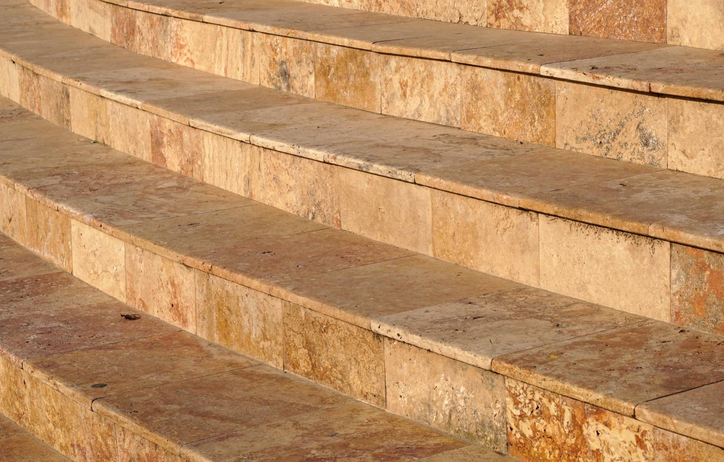 <p>Travertine is a porous, banded form of sedimentary limestone (<span>) deposited by hot springs and mineral waters. Often featuring yellow, beige, or white tones, this is a durable, natural stone</span></p>