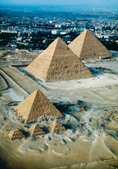 <p>three pyramids of Gizeh took the shape of the ben -ben, the emblem of the sun god, Re. The sun's rays were the ramp the Egyptian kings used to ascend to the heavens after their death and rebirth</p>
