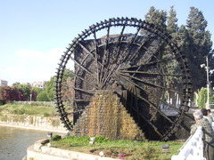 <p>a wheel made to turn by the water flowing through it</p>