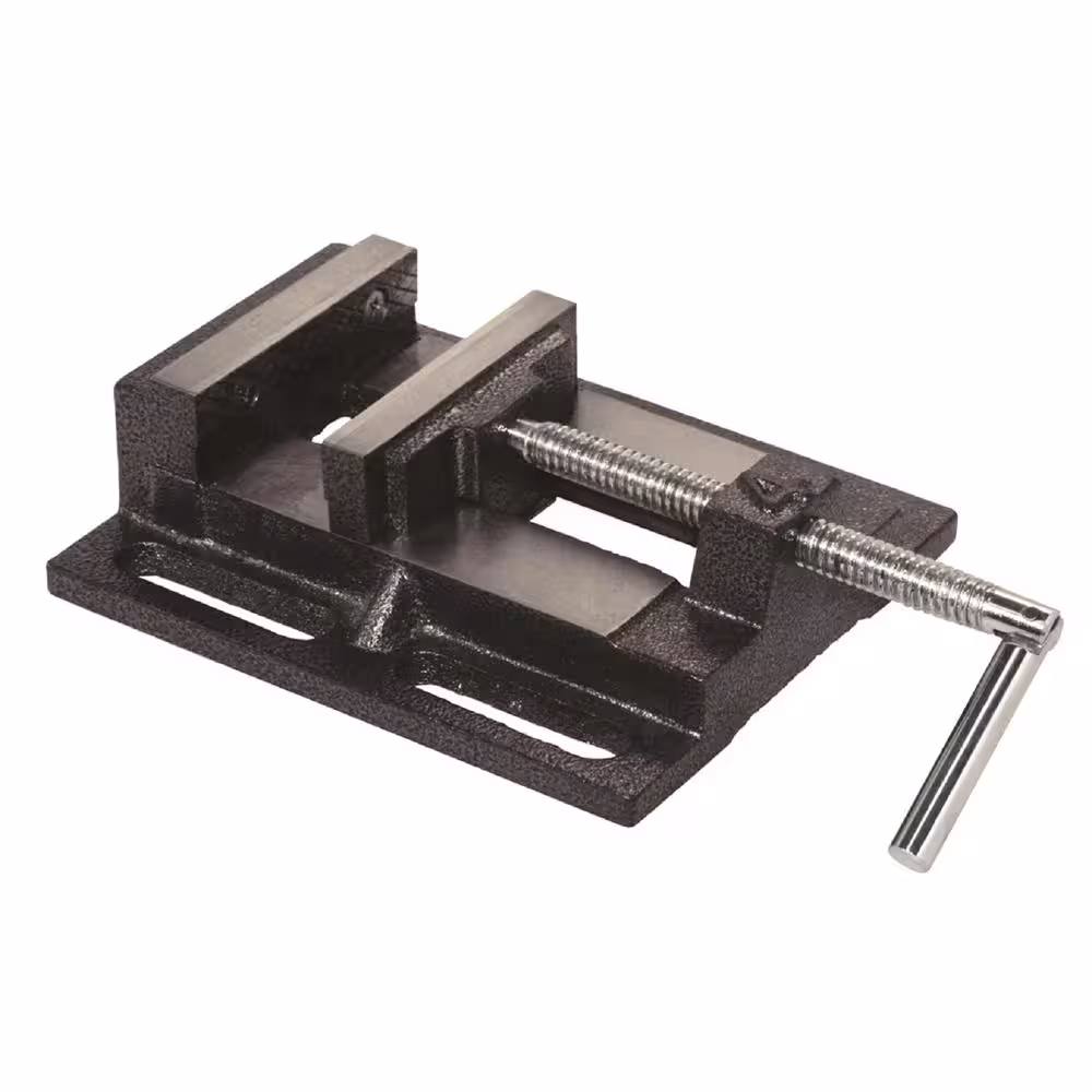 <p>Clamping fixture with two adjustable jaws and mounting base (often with bolt slots) used to hold workpieces securely during drilling.</p>