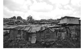 <p><span style="background-color: transparent; font-family: "Times New Roman", serif;">The construction of makeshift housing in a country within the periphery, as shown in the photograph, is often the result of what?</span></p>