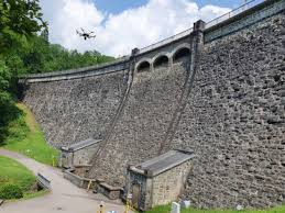 <p>a dam constructed of concrete and or masonry, which relies on its weight and internal strength for stability </p><ul><li><p>stone masonry gravity dams</p></li><li><p>stone masonry arch dams </p></li><li><p>hollow gravity dam</p></li></ul><p></p>
