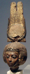 <p>portrait of Akhenaton's mother is carved of dark yew wood, possibly to match the queen's complexion; during her son's reign, the tall gold crown with the sun disk and cow horns was added</p>