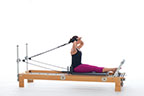 <p><strong>Setup</strong></p><ul><li><p>Starting in Hug-a-Tree position (page 72), arms bent, hands in straps in line with eyes, fingers facing forward</p></li><li><p>Resistance: light to medium | <strong>Springs: 1B or 1R</strong></p></li></ul><p><strong>Movement</strong></p><ul><li><p>Exhale: Straighten arms forward and up on diagonal line</p></li><li><p>Inhale: Bend arms, return to start position</p></li></ul><p><strong>Muscle Focus</strong></p><ul><li><p>Elbow extensors</p></li><li><p>Shoulder flexors</p></li><li><p>Scapular stabilizers</p></li><li><p>Spinal extensors</p></li></ul><p><strong>Objectives</strong></p><ul><li><p>Elbow extensor strength</p></li><li><p>Shoulder flexor control</p></li><li><p>Scapular stabilization</p></li><li><p>Trunk stabilization</p></li></ul><p><strong>Cues</strong></p><ul><li><p>Maintain scapular stabilization</p></li><li><p>Keep elbows lifted and reaching outward</p></li><li><p>Keep fingers pointing in direction of movement</p></li></ul><p></p>