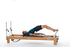 <p><strong>Setup</strong></p><ul><li><p>Starting in Bottom Lift position (page 42)</p></li><li><p>Resistance: medium | <strong>Springs: 2R (or 2R + 1B)</strong></p></li></ul><p><strong>Movement</strong></p><ul><li><p>Exhale: Roll spine up</p></li><li><p>Inhale: Pause</p></li><li><p>Exhale: Straighten legs (not completely)</p></li><li><p>Inhale: Bend legs</p></li><li><p>Repeat extension 5 - 10 times</p></li><li><p>Final Exhale: Roll spine down, return to start position</p></li></ul><p><strong>Muscle Focus</strong></p><ul><li><p>Spinal flexors</p></li><li><p>Hip extensors</p></li><li><p>Knee extensors</p></li></ul><p><strong>Objectives</strong></p><ul><li><p>Spinal articulation</p></li><li><p>Hip extensor control</p></li><li><p>Knee extensor control</p></li></ul><p><strong>Cues</strong></p><ul><li><p>Feet position is same as Parallel Toes in Footwork (page 18)</p></li><li><p>Keep heels still, adductors engaged and legs parallel</p></li><li><p>Do not straighten knees completely</p></li><li><p>Keep pelvis lifted during extensions</p></li></ul><p></p>