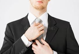 <p>The man is adjusting his tie.</p>